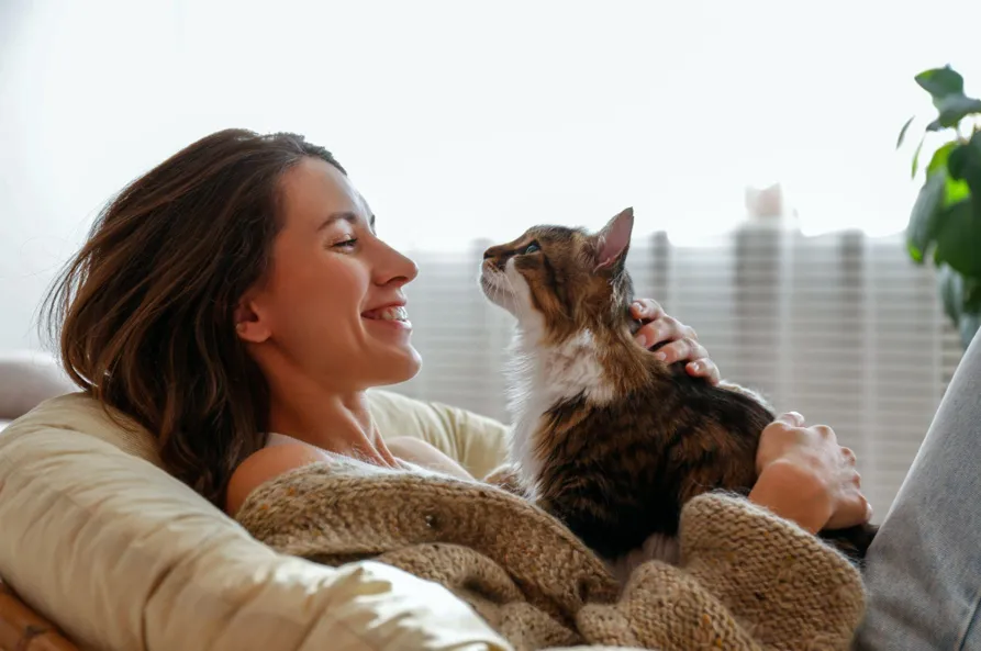 Can I Make My Cat a Service Animal? Your Questions Answered A young woman holding a cat and asking herself – can I make my cat a service animal